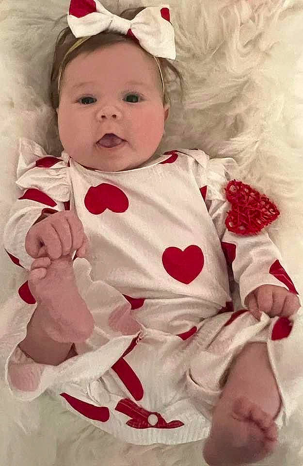 Oakley is registered to the contest to win money with this photo: baby, baby_toddler_clothing, cheek, child, clothing, collar, costume_hat, dress, face, facial_expression, happy, head, headband, lip, peach, person, pink, skin, sleeve, toddler