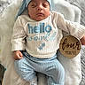 Santiago joined the competition — help win amazing prizes! baby, sleeping, blue_clothing, white_blanket, wooden_sign, milestone, infant, knit_hat, knit_pants, knit_sweater, socks, cute, portrait, indoors, soft_texture, peaceful, child, resting, newborn, lying_down