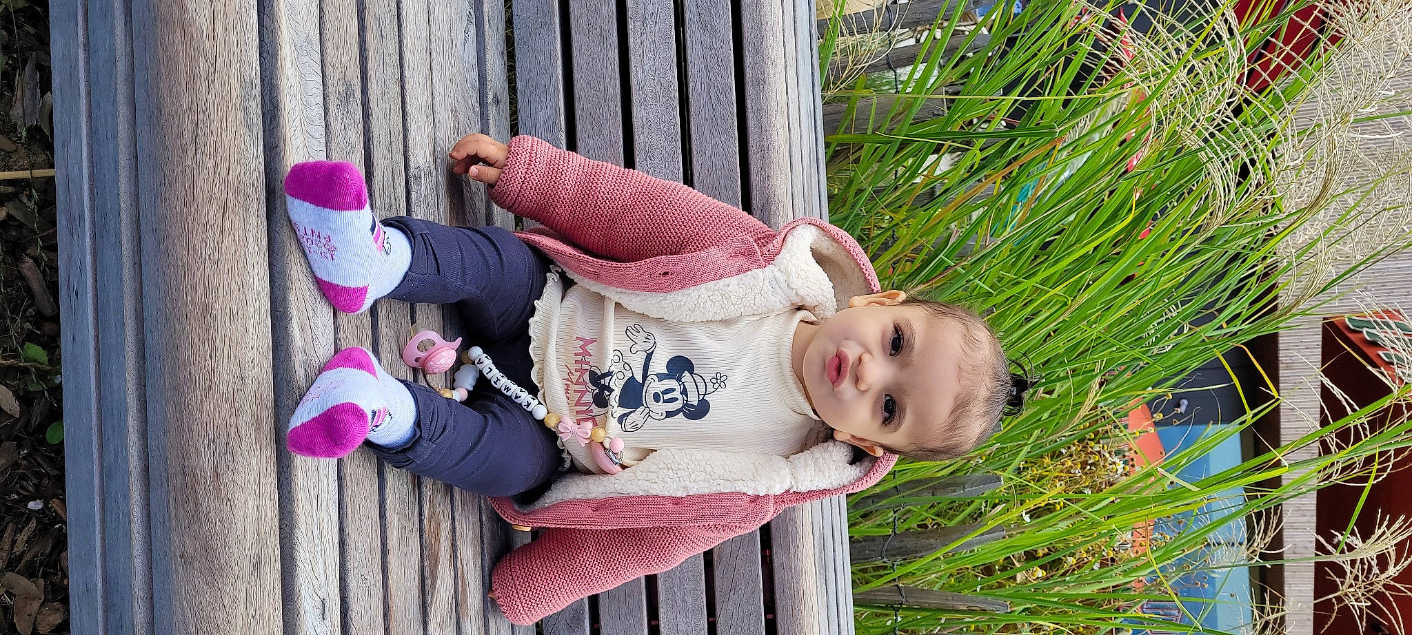 Kamila a rejoint le concours — aidez-le/la à gagner de superbes lots ! baby, baby_products, baby_toddler_clothing, cheek, child, eye, garden, grass, happy, headgear, leisure, pattern, person, pink, plant, sitting, smile, textile, toddler, tree