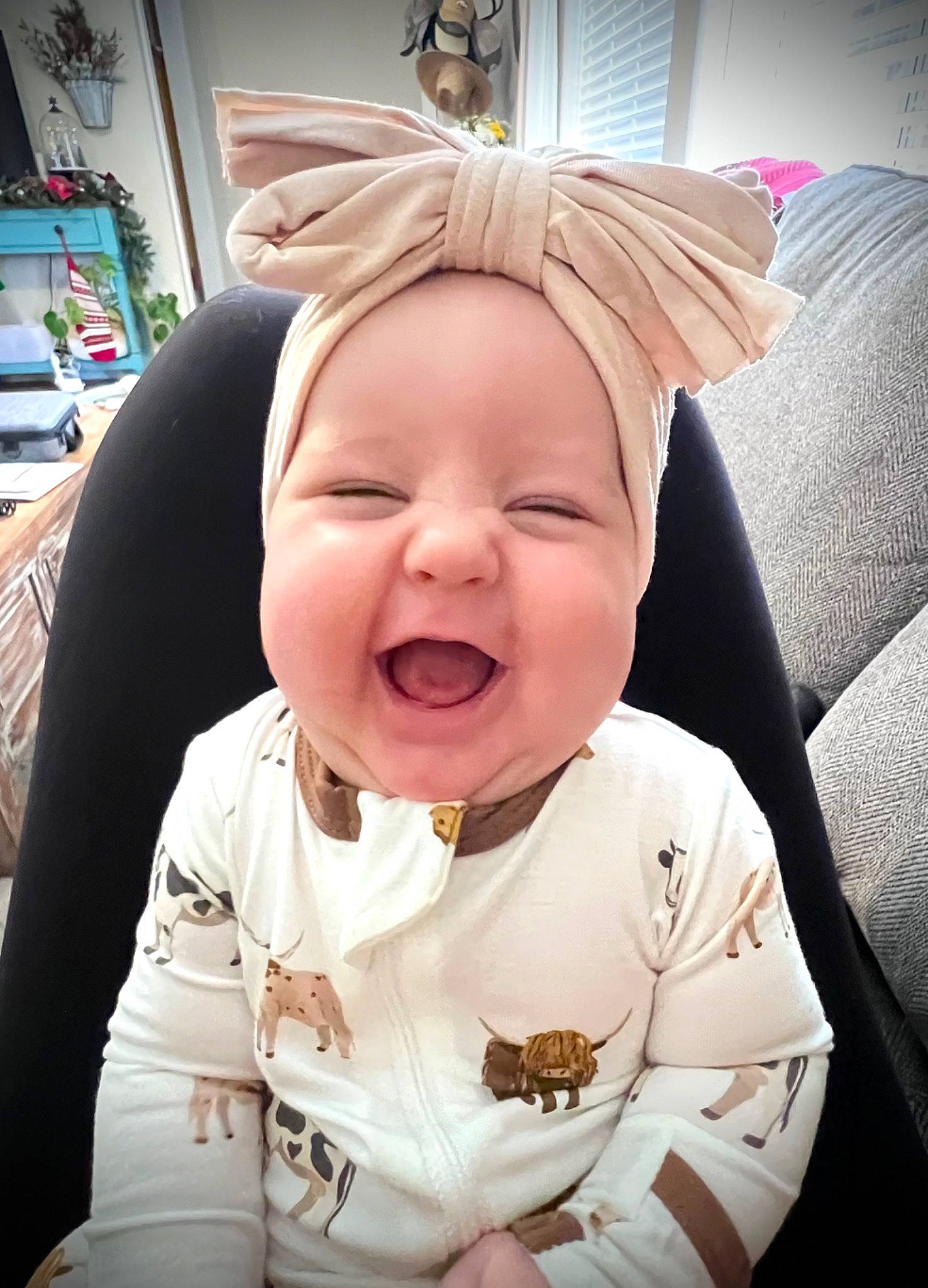 Emerson is registered to the contest to win money with this photo: baby, baby_toddler_clothing, cheek, comfort, eye, eyebrow, fun, gesture, happy, headwear, human_body, laugh, lip, mouth, nose, person, skin, sleeve, smile, t_shirt