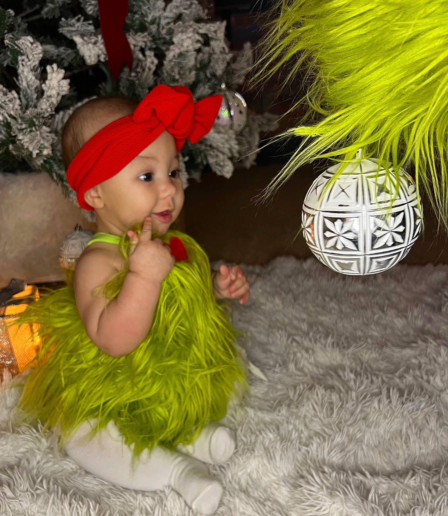 Aaliyah is registered to the contest to win money with this photo: baby, baby_toddler_clothing, beanie, cap, child, costume, costume_accessory, costume_hat, event, fashion_accessory, flowerpot, fun, fur, grass, headpiece, headwear, houseplant, knit_cap, person, plant