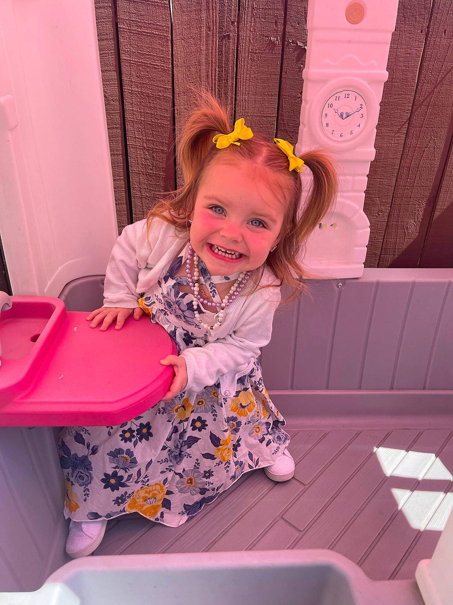 Brynlei is registered to the contest to win money with this photo: baby_toddler_clothing, beauty, chair, child, comfort, door, flower, fun, happy, joy, magenta, pattern, peach, person, pink, plastic, purple, room, sitting, smile