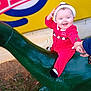 Hazel joined the competition — help win amazing prizes! baby, child, smiling, red_clothing, hat, dinosaur_statue, green, outdoor, grass, hand_holding, joyful, festive, winter_clothing, portrait, playful, toy, person, statue, daylight, background