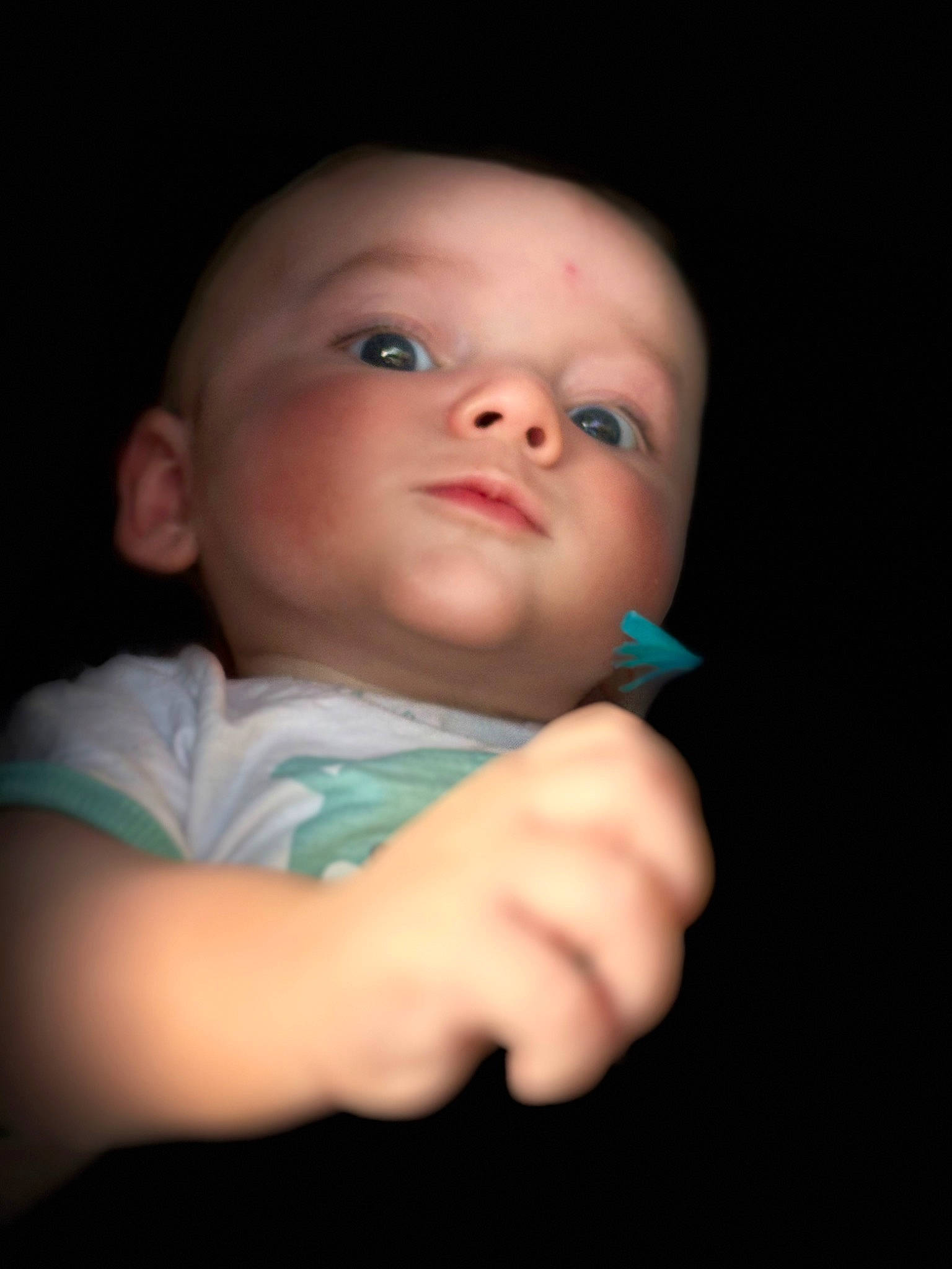 Mylo participe au concours pour gagner de l'argent avec cette photo : baby, baby_toddler_clothing, cheek, comfort, darkness, eyelash, finger, flash_photography, fun, gesture, iris, jaw, lip, mouth, nail, nose, person, room, sitting, sleeve