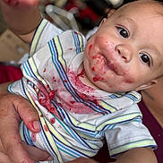 Aizen is registered to the contest to win money with this photo: baby, child, face, messy, food, stains, shirt, striped, hand, holding, curious, closeup, indoor, person, cute, expression, mess, feeding, infant, portrait