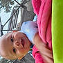 Aizen is registered to the contest to win money with this photo: baby, child, blanket, pink, green, mesh, outdoor, smiling, face, toy, vehicle, person, clothing, blue, striped, playpen, hand, happy, daytime, blur