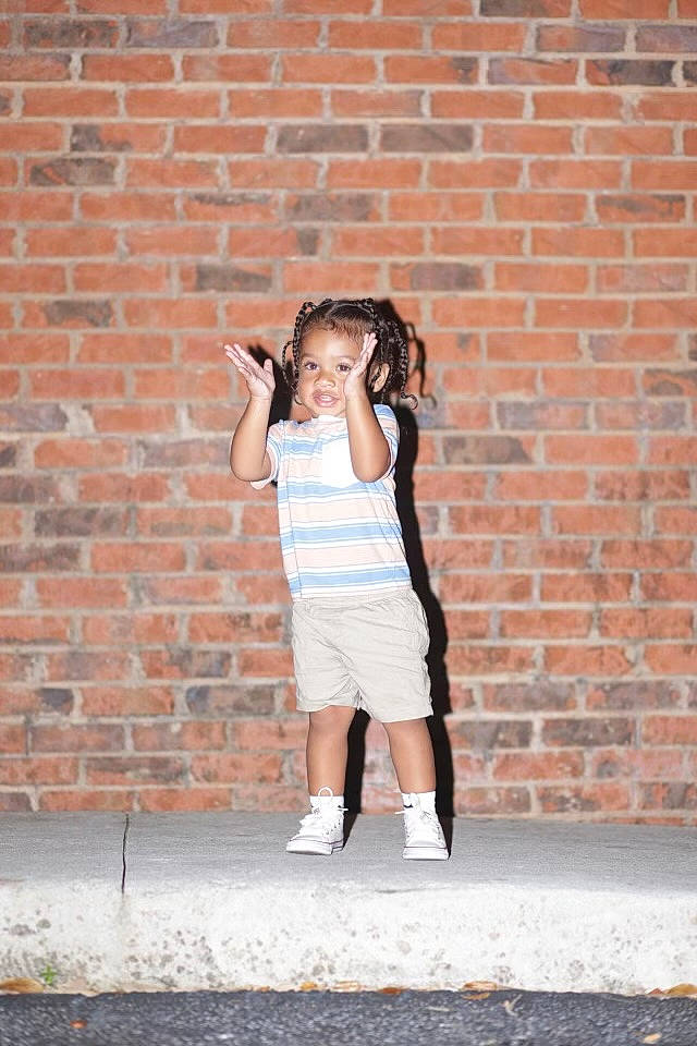 Jeremiah joined the competition — help win amazing prizes! art, asphalt, brick, brickwork, brown_hair, flash_photography, grey, hair, happy, human_leg, orange, person, road, shorts, sitting, standing, street, t_shirt, thigh, toddler