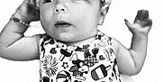 Shado is registered to the contest to win money with this photo: baby, infant, headband, bow, cartoon_print, black_and_white, portrait, cute, clothing, patterned, arms, face, eyes, curious, smile, child, young, studio, closeup, soft_focus