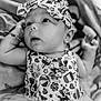 Shado joined the competition — help win amazing prizes! baby, infant, headband, patterned_clothing, black_and_white, close_up, cute, looking_up, tutu, soft_texture, portrait, child, young, small, adorable, wearing, fashion, indoors, person, expression
