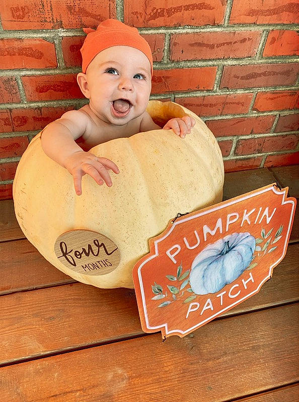 Cooper joined the competition — help win amazing prizes! baby, brick, brickwork, carmine, child, happy, hat, headwear, orange, peach, person, sitting, smile, toddler, toy, wood