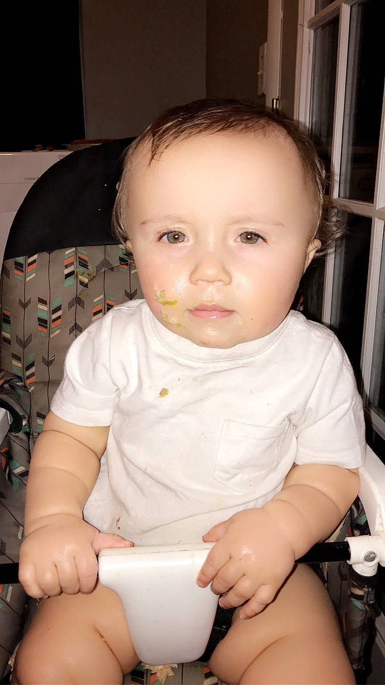 Donnie is registered to the contest to win money with this photo: arm, baby, baby_products, baby_toddler_clothing, cheek, child, cup, dishware, ear, hand, iris, nose, person, porcelain, serveware, sitting, skin, sock, toddler