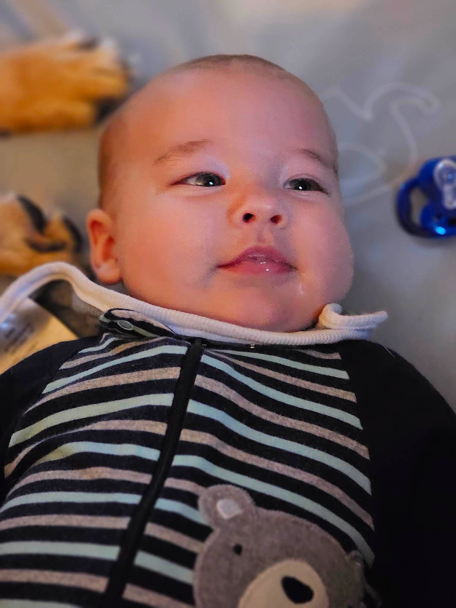 Jonathan joined the competition — help win amazing prizes! baby, baby_toddler_clothing, cheek, child, collar, comfort, fun, happy, nose, organ, outerwear, pattern, person, product, room, sitting, skin, sleeve, smile, t_shirt