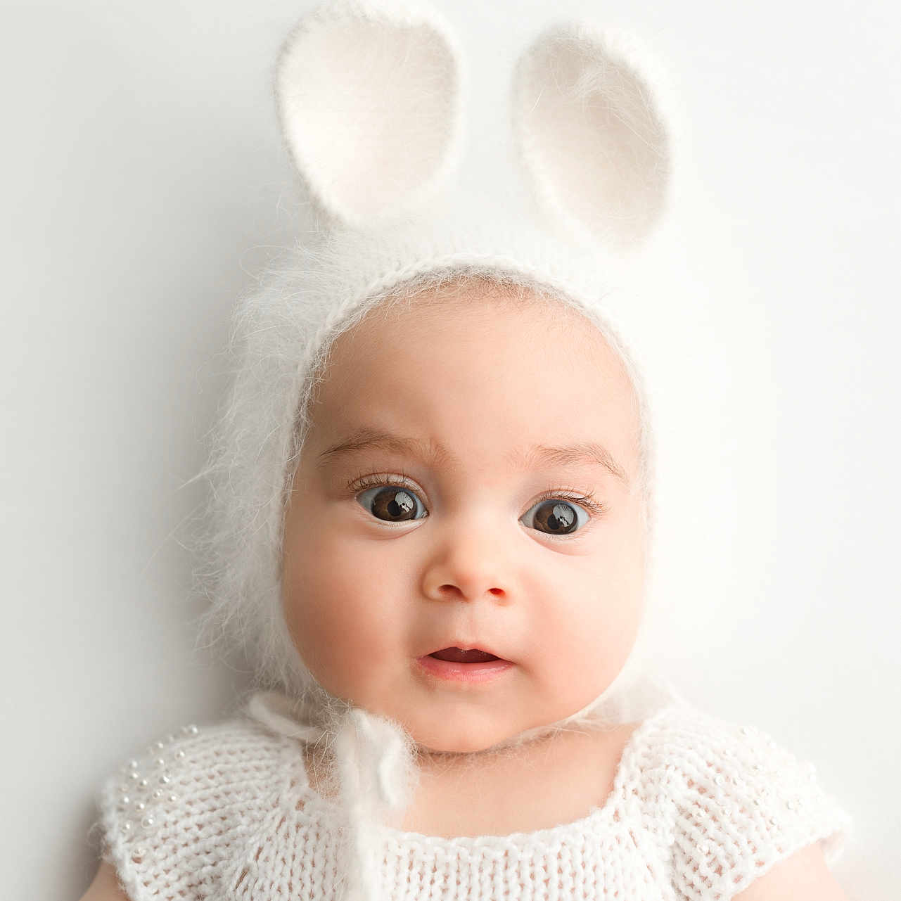 Elle Sofia is registered to the contest to win money with this photo: accessories, baby, beanie, bonnet, cap, clothing, face, frown, happy, hat, head, headband, newborn, person, photography, portrait, sad, smile