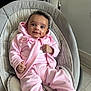 baby, baby_seat, casual, child, comfortable, cozy, curly_hair, cute, floor, happy, home, indoor, infant, pink_clothing, portrait, seated, small_hands, smiling, soft_toys, young_child