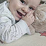 baby, bodypart, crib, cushion, face, finger, furniture, hand, happy, head, homedecor, infantbed, laughing, newborn, person, photography, portrait, quilt, sitting, smile