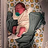baby, newborn, sleeping, crib, pacifier, blanket, onesie, sock, bedding, winnie_the_pooh, polka_dots, infant, face, child, toddler, soft_lighting, indoors, cozy, sleep, rest
