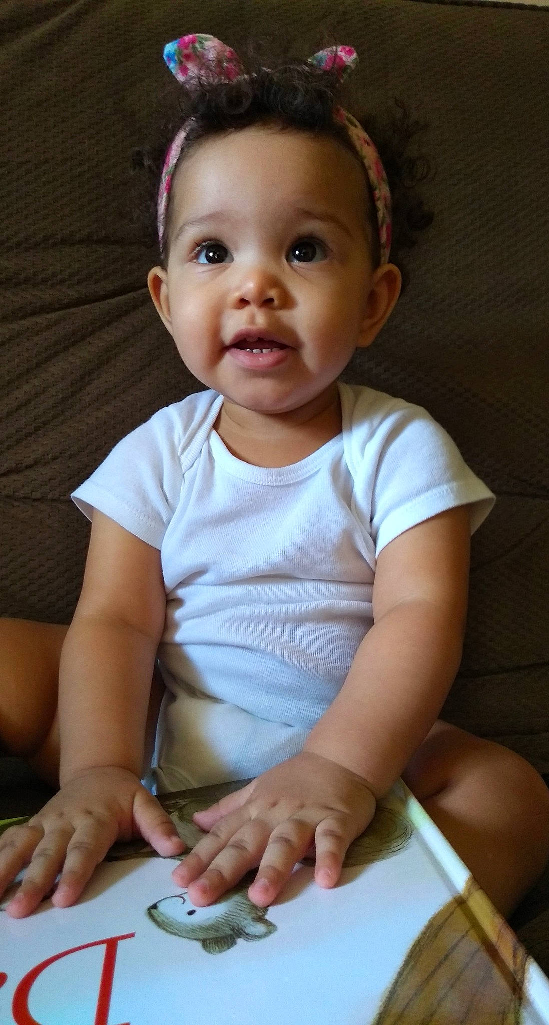 Lena is registered to the contest to win money with this photo: baby, baby_toddler_clothing, cheek, child, chin, face, facial_expression, head, lip, nose, person, play, sitting, skin, smile, toddler, tummy_time