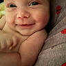 Legend is registered to the contest to win money with this photo: baby, smile, face, skin, arm, close_up, infant, cute, cheeks, eyes, soft_light, fabric, ladybug_pattern, comfort, child, newborn, portrait, happy, candid, indoors