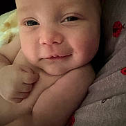 Legend joined the competition — help win amazing prizes! baby, infant, face, smile, skin, hand, fist, closeup, portrait, child, cute, expression, lying_down, pattern, ladybug, fabric, soft_light, warm, indoor, resting