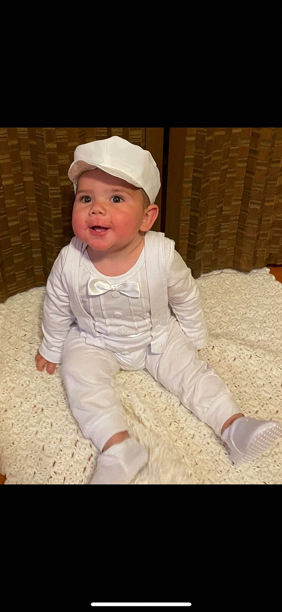 Jerry is registered to the contest to win money with this photo: baby, baby_toddler_clothing, cap, cheek, child, comfort, cool, flooring, fun, fur, grass, happy, headwear, pattern, peach, person, portrait_photography, sitting, skin, sleeve