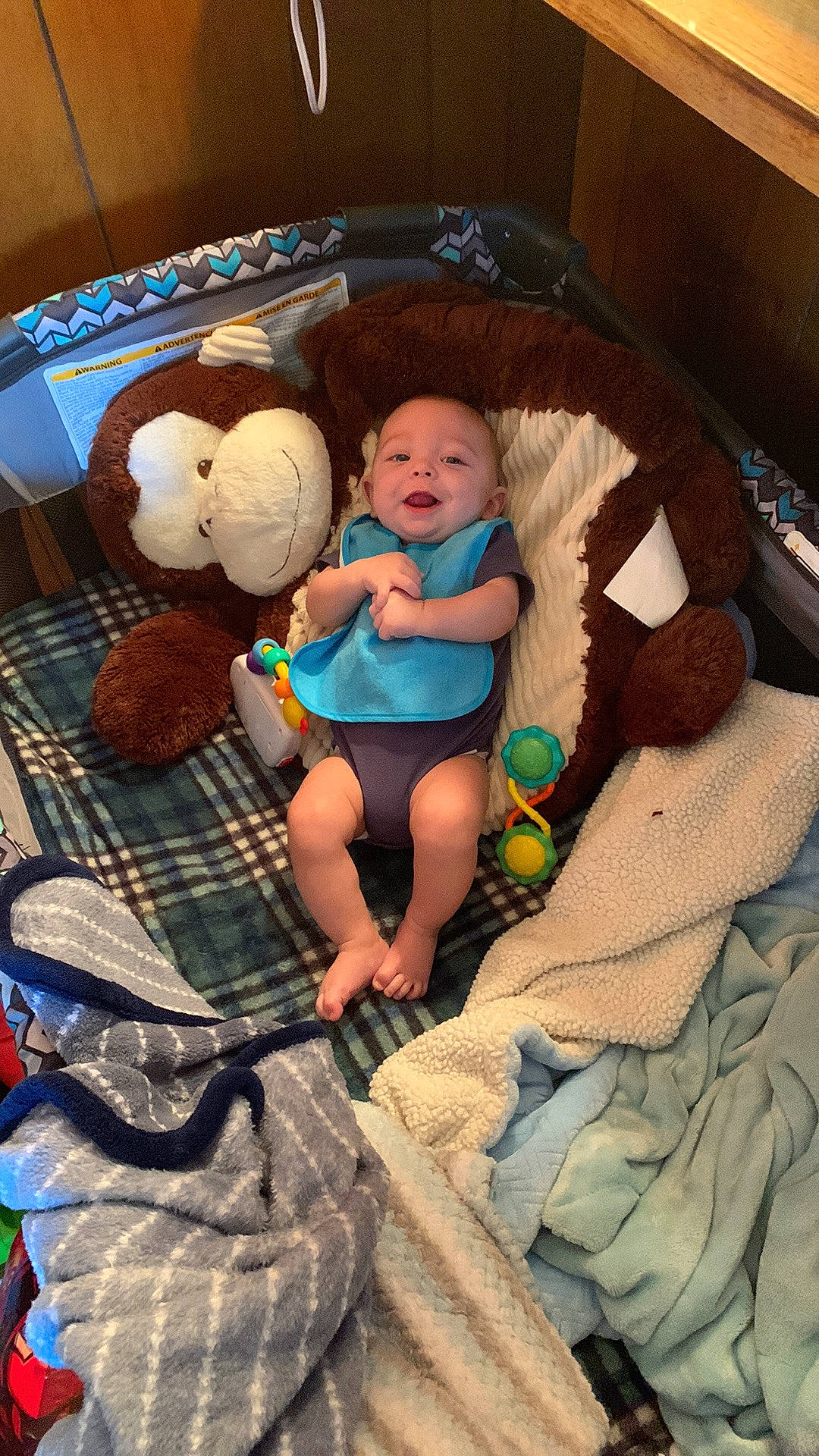 Colton is registered to the contest to win money with this photo: baby, baby_products, baby_toddler_clothing, baby_toys, child, comfort, doll, lap, linens, mammal, person, room, shorts, sitting, sock, stuffed_toy, textile, toddler, toy, vertebrate