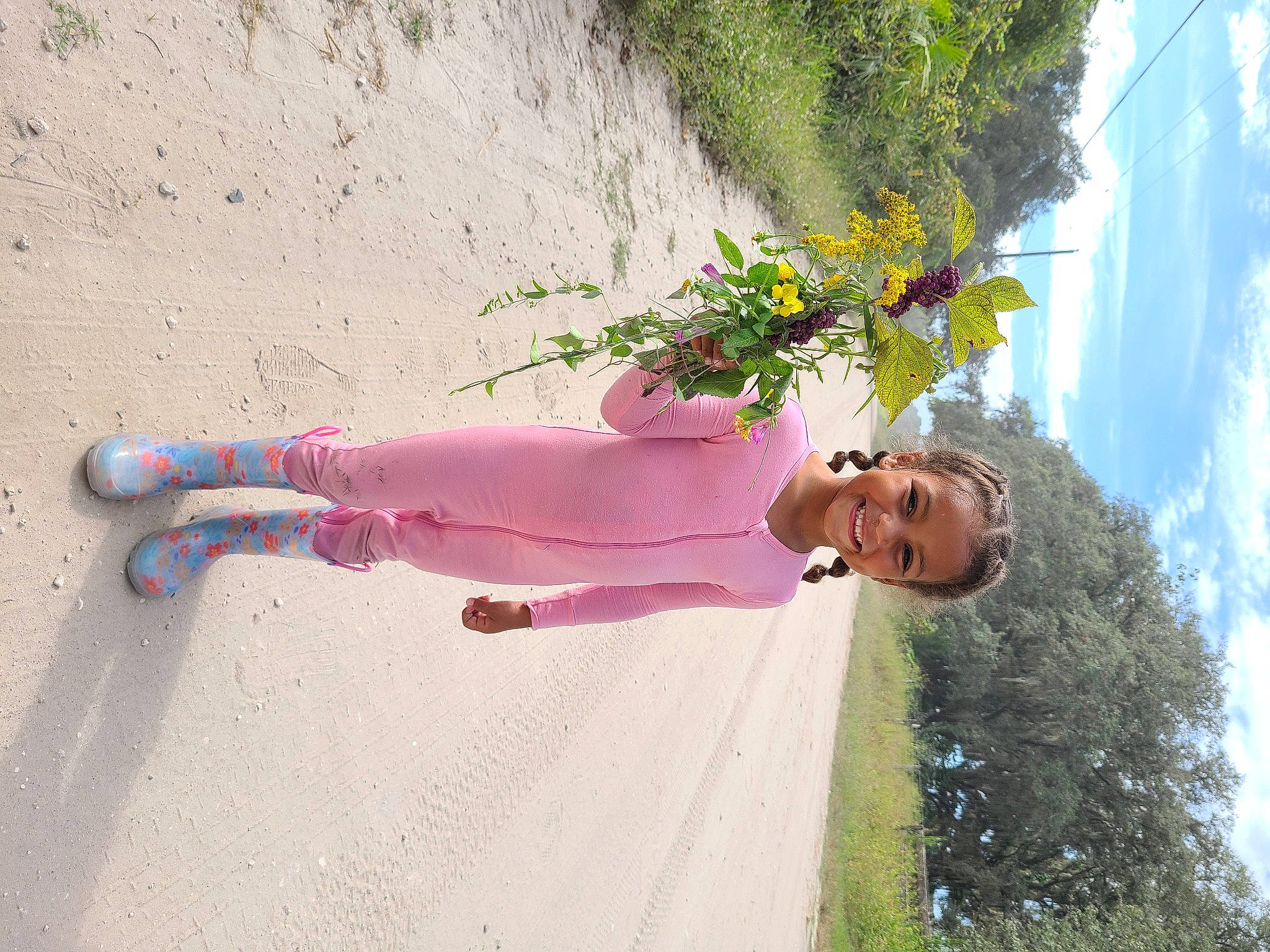 Katie is registered to the contest to win money with this photo: floral_design, flower, flower_arranging, fun, grass, happy, joy, landscape, leisure, magenta, people_in_nature, person, petal, plant, shadow, sky, tree, vacation