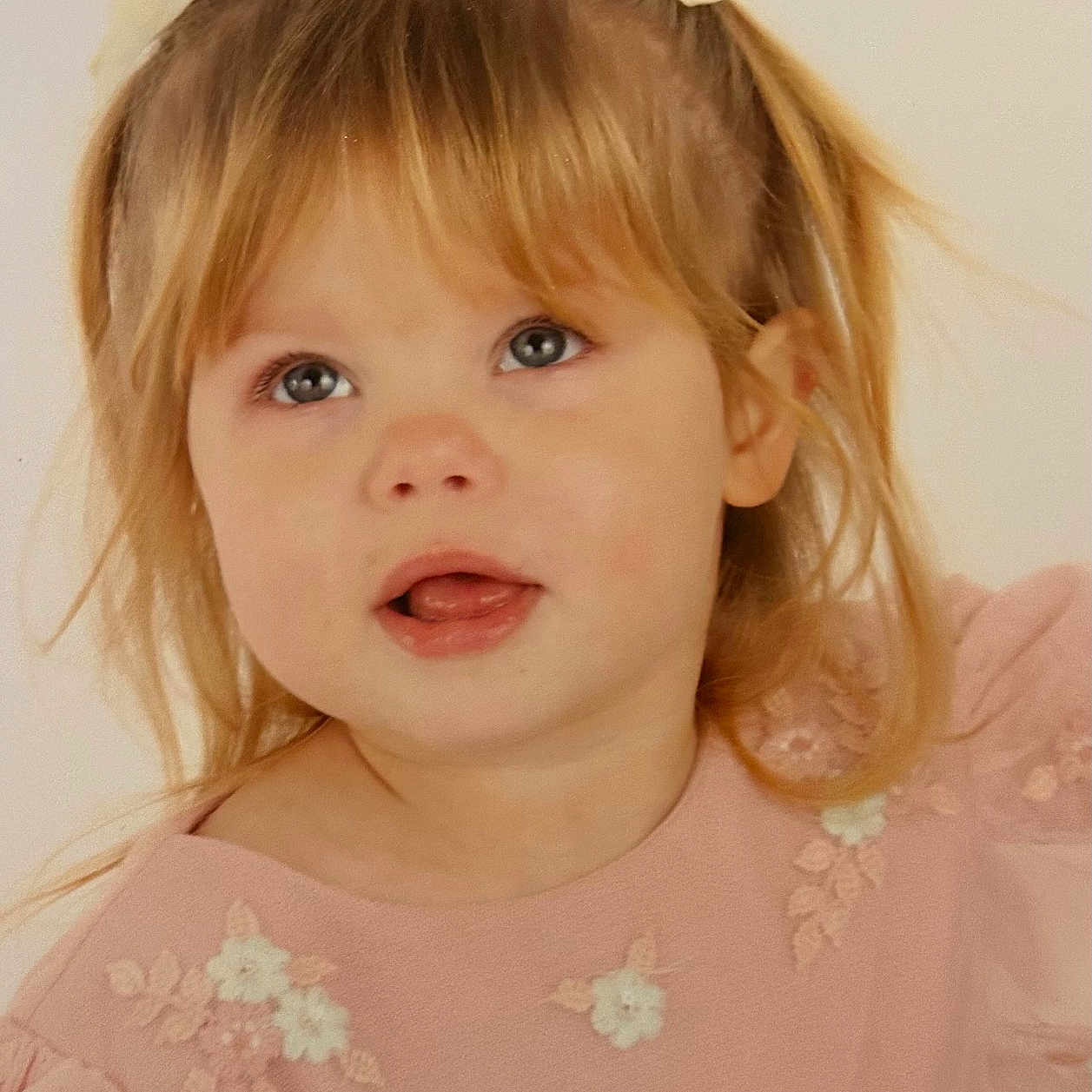 Hailey-Rae is registered to the contest to win money with this photo: blue_eyes, child, cute, embroidery, expression, face, fashion, girl, hair_buns, happy, innocence, person, pink_dress, portrait, ribbons, smiling, soft_light, studio, toddler, young_child