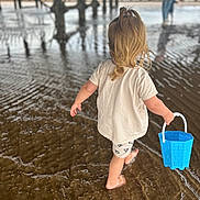 Hailey-Rae joined the competition — help win amazing prizes! child, blonde_hair, ponytail, barefoot, bucket, water, shallow_water, ripples, pier, beach, sand, reflection, person, summer, outdoor, play, walking, casual_clothing, shorts, tshirt