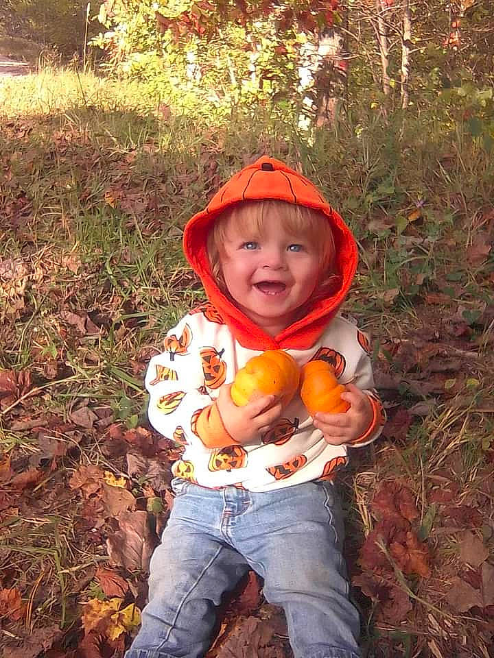 Javon is registered to the contest to win money with this photo: adaptation, apple, botany, calabaza, cucurbita, gourd, grass, happy, headwear, jeans, nature, orange, people_in_nature, person, plant, pumpkin, smile, toddler, tree, vegetable