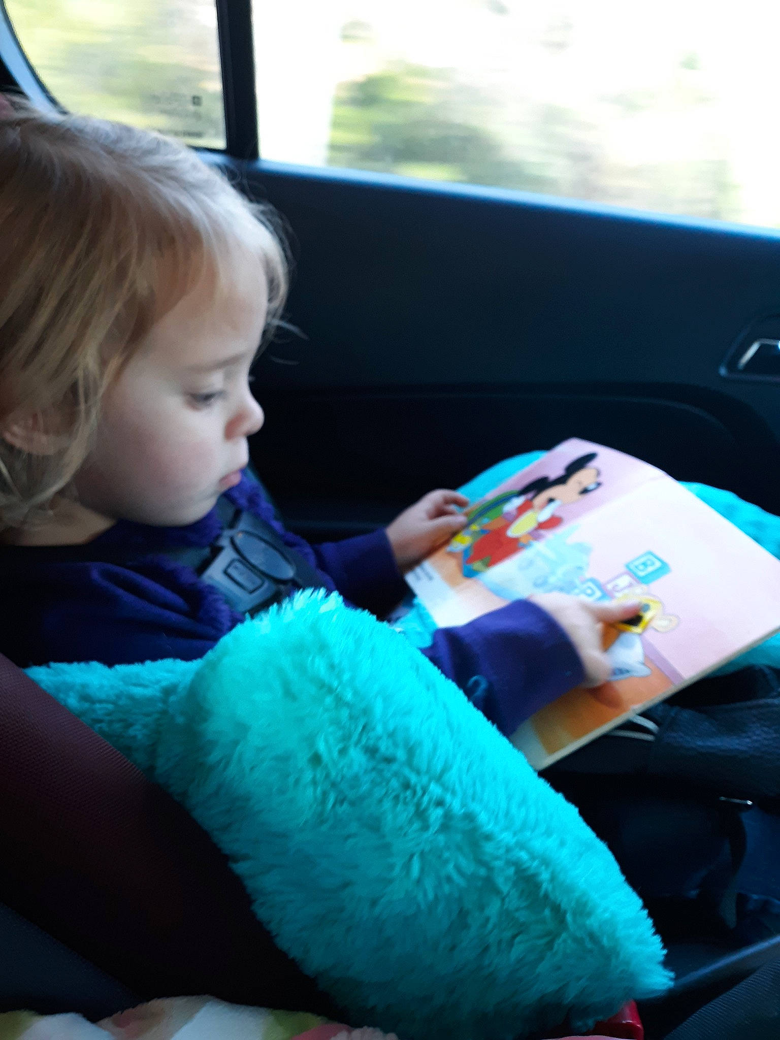 Zoie is registered to the contest to win money with this photo: baby, car_seat, child, electronic_device, person, play, sitting, technology, toddler