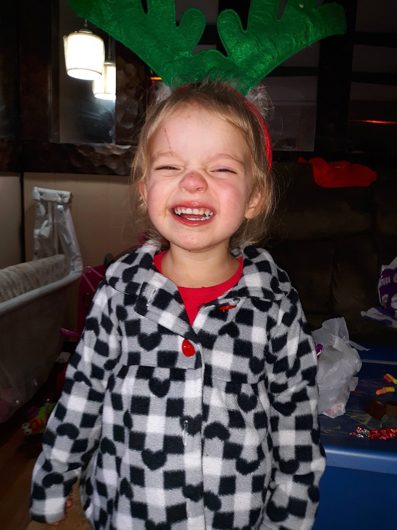 Zoie is registered to the contest to win money with this photo: child, face, fun, head, joy, laugh, outerwear, pattern, person, smile, toddler