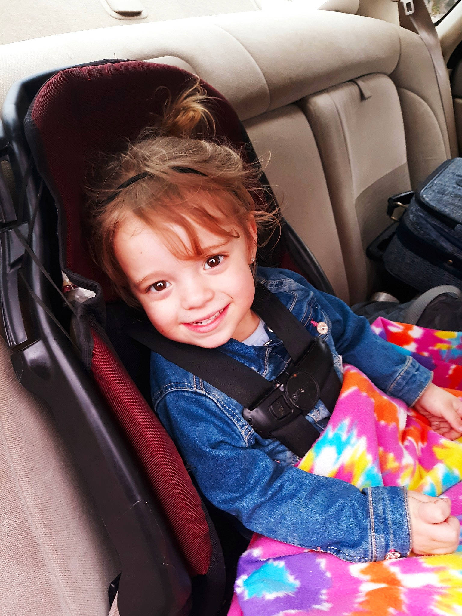 Zoie is registered to the contest to win money with this photo: auto_part, car, car_seat, car_seat_cover, child, family_car, fun, joy, luxury_vehicle, person, seat_belt, sitting, smile, steering_wheel, toddler, vehicle, vehicle_door
