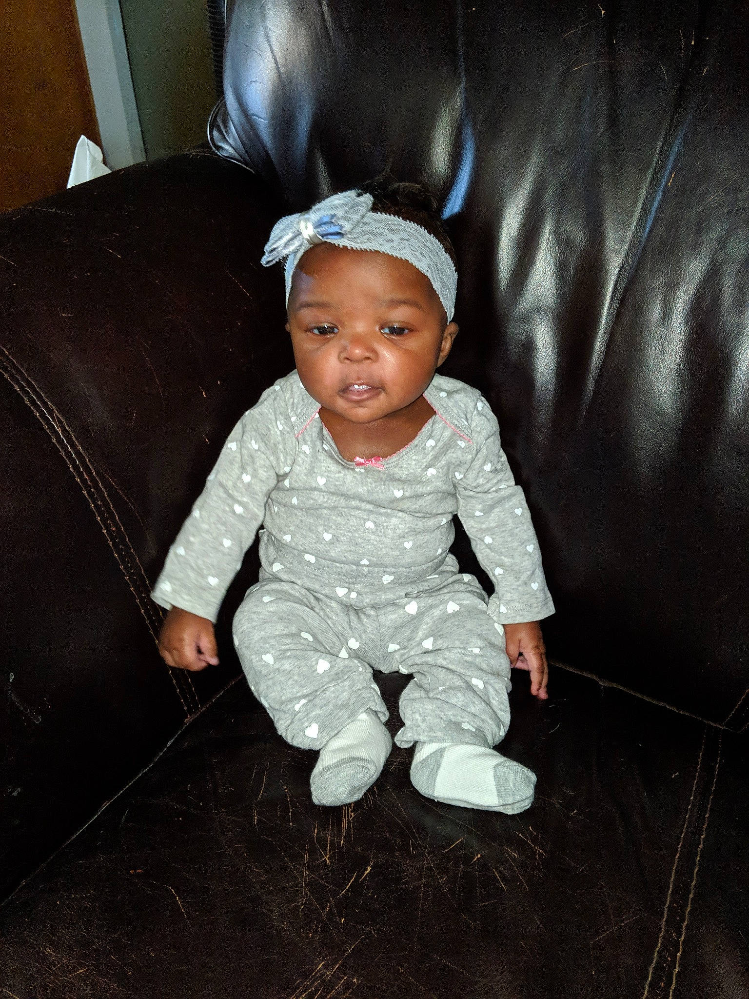 Cherish is registered to the contest to win money with this photo: baby, child, fun, hair_accessory, head, person, sitting, skin, smile, standing, toddler