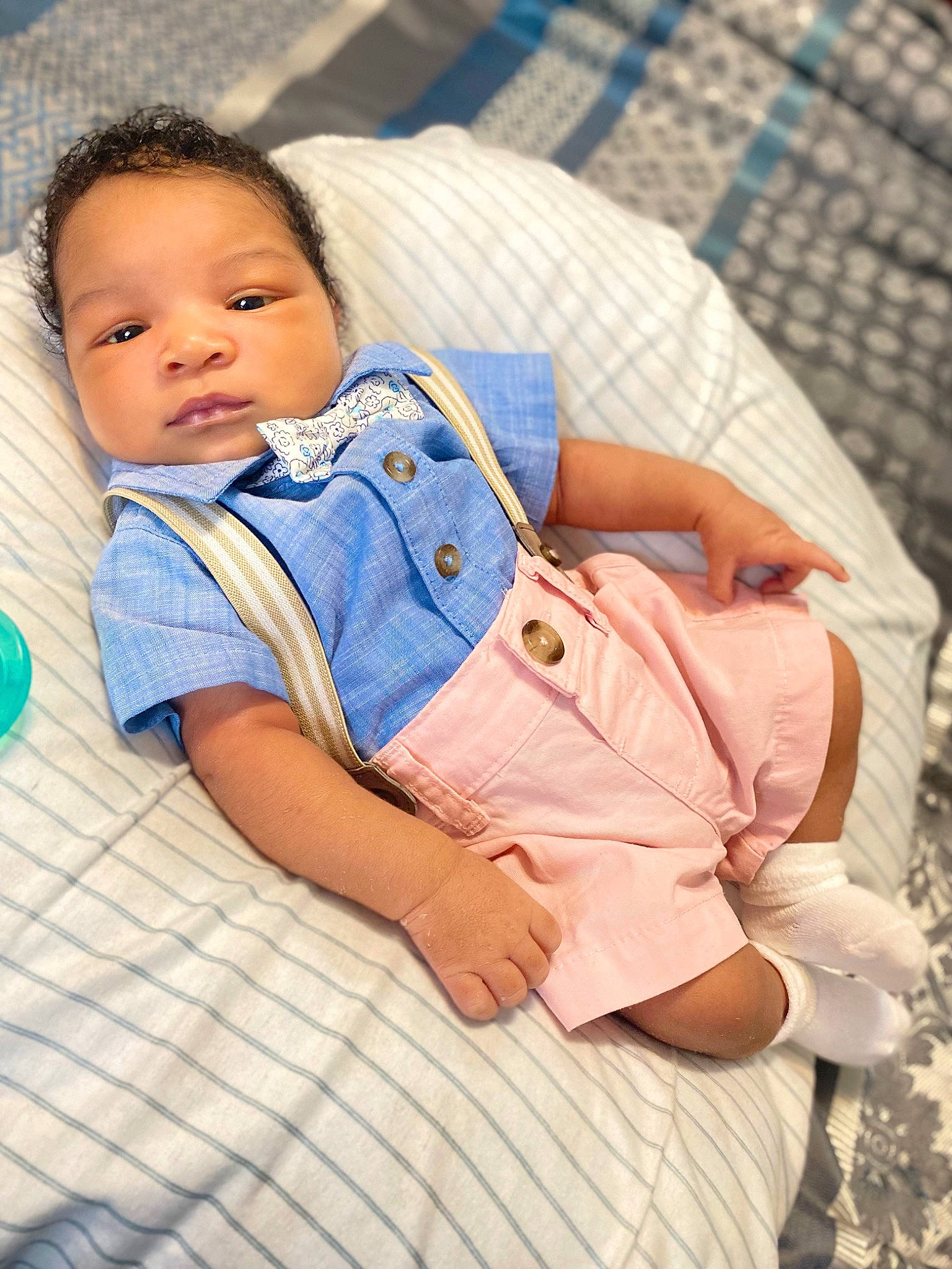 Kyaire is registered to the contest to win money with this photo: baby, baby_products, baby_toddler_clothing, blue, child, comfort, electric_blue, face, happy, human_leg, leisure, linens, nose, pattern, person, sitting, skin, sleeve, textile, thigh