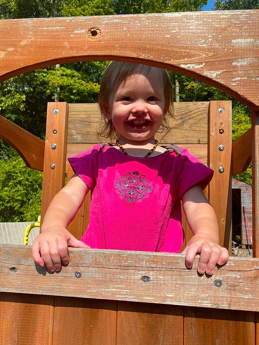 Percilla joined the competition — help win amazing prizes! baby_toddler_clothing, child, fun, grass, happy, hardwood, joy, leisure, magenta, person, pink, play, public_space, recreation, sleeve, smile, t_shirt, thumb, toddler, tree