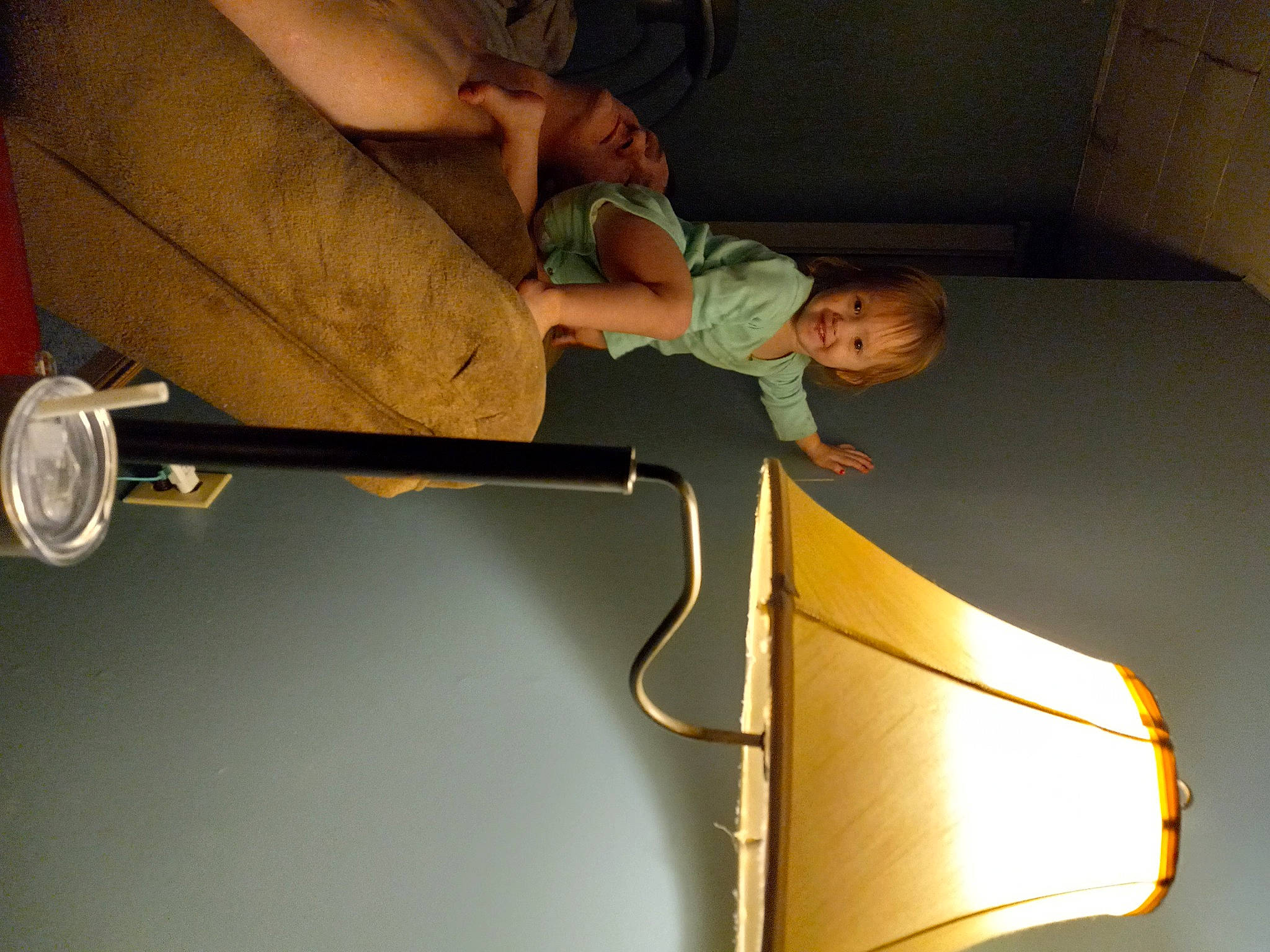 Percilla is registered to the contest to win money with this photo: baby, balance, ceiling, comfort, elbow, flooring, fun, joy, knee, leg, leisure, light_fixture, metal, person, recreation, room, sitting, toddler, vehicle_door, wood