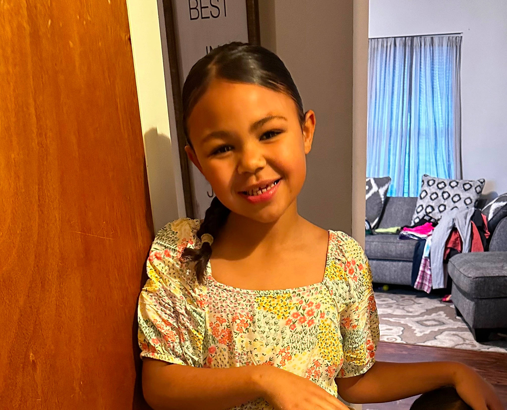 Kensleigh is registered to the contest to win money with this photo: backpack, bag, baggage, child, comfort, curtain, event, eye, eyebrow, flooring, fun, happy, jewellery, joy, laugh, luggage_and_bags, necklace, person, room, sitting