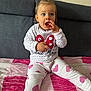 Milena joined the competition — help win amazing prizes! toddler, child, sitting, sofa, blanket, pink, white, clothing, sweater, pants, hearts, polka_dot, minnie_mouse, indoor, person, cute, young_child, face, hand, expression