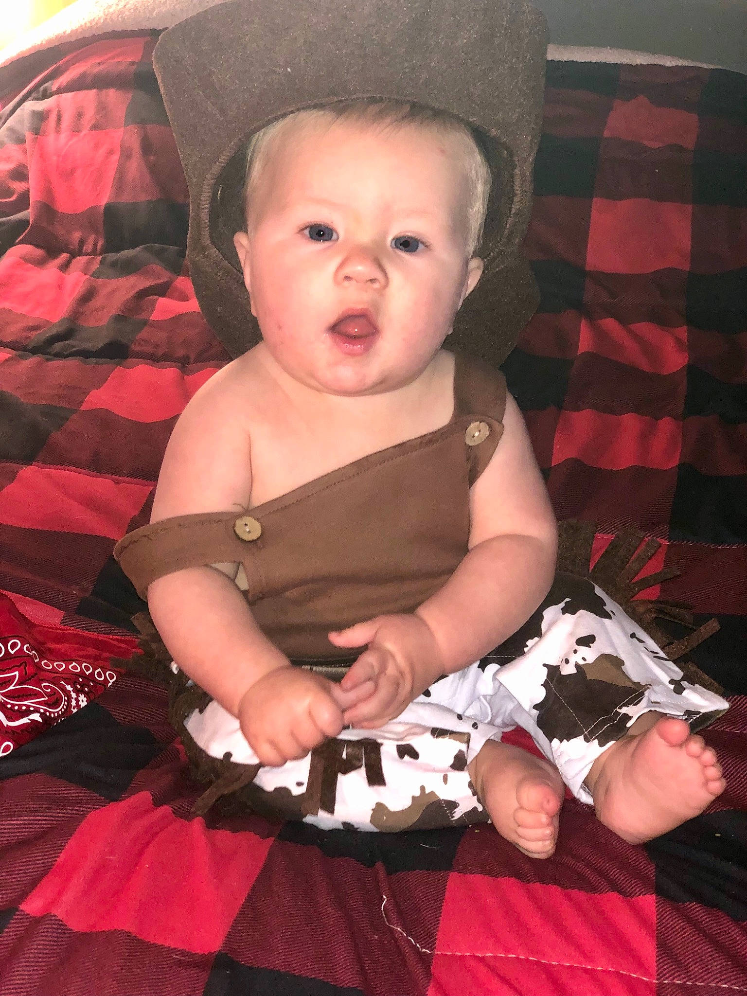 Leland is registered to the contest to win money with this photo: baby, baby_products, baby_toddler_clothing, black, child, dress, event, fashion_accessory, finger, flash_photography, fun, hand, happy, hat, lap, pattern, person, pink, sitting, skin