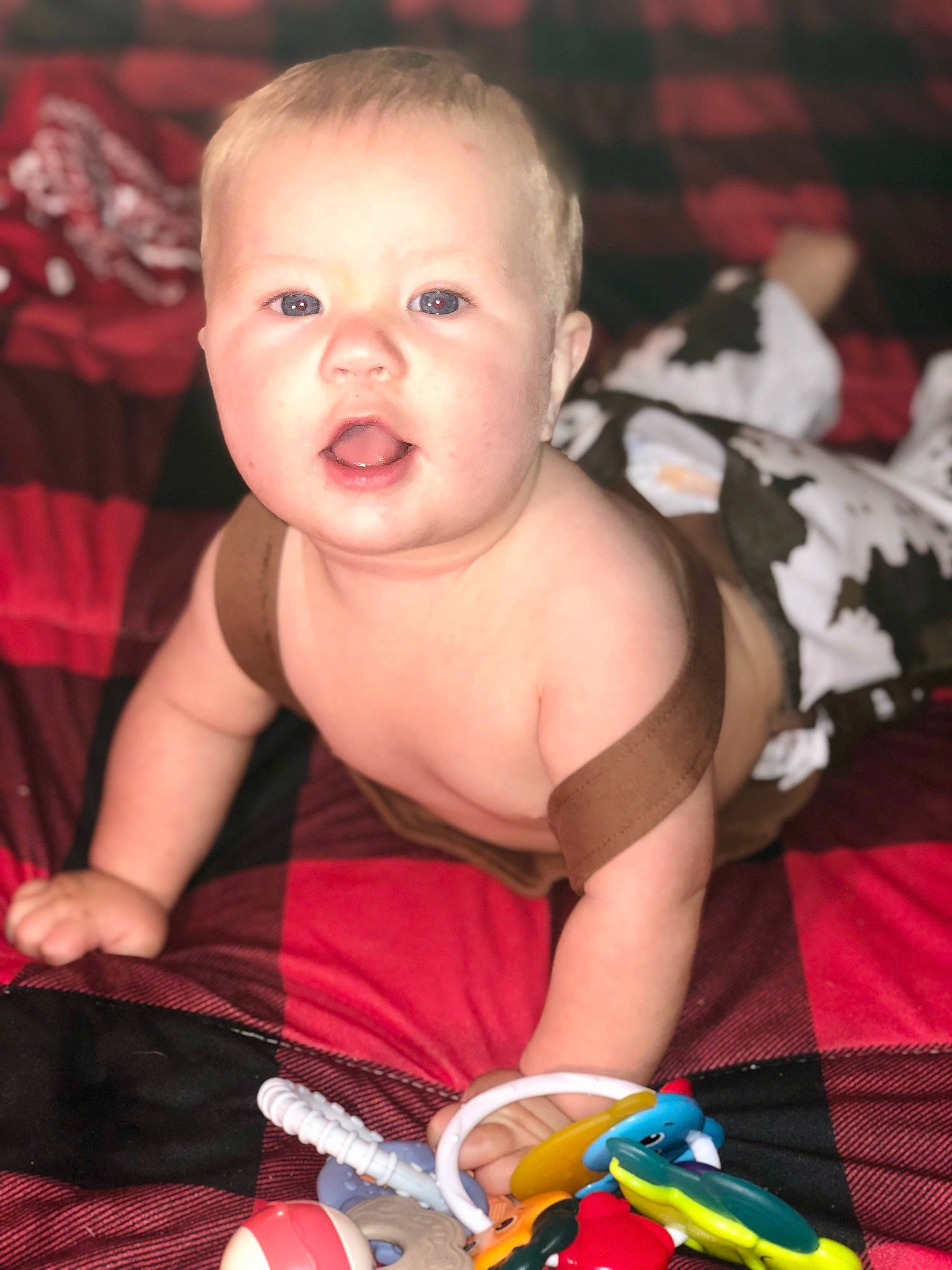 Leland is registered to the contest to win money with this photo: baby, baby_toddler_clothing, beauty, cheek, child, dress, event, eye, finger, fun, hand, happy, human_body, iris, mammal, mouth, person, red, skin, snapshot