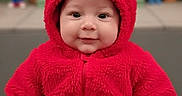 Zachariah is registered to the contest to win money with this photo: baby, child, costume, elmo, red_clothing, cute, smile, portrait, infant, hooded_jacket, face, eyes, indoor, colorful, background, plush, young_child, sitting, happy, closeup