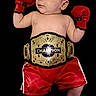 Zachariah joined the competition — help win amazing prizes! adorable, baby, belt, black_background, boxing, boxing_gloves, championship_belt, child, costume, cute, funny, gloves, infant, playful, portrait, red_booties, red_shorts, small, sportswear, studio_photo
