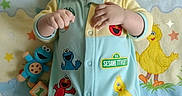 Zachariah is registered to the contest to win money with this photo: baby, big_bird, blanket, blocks, child, colorful, cookie_monster, cute, elmo, indoors, infant, lying_down, onesie, oscar_the_grouch, pattern, playful, sesame_street, smiling, soft, toy