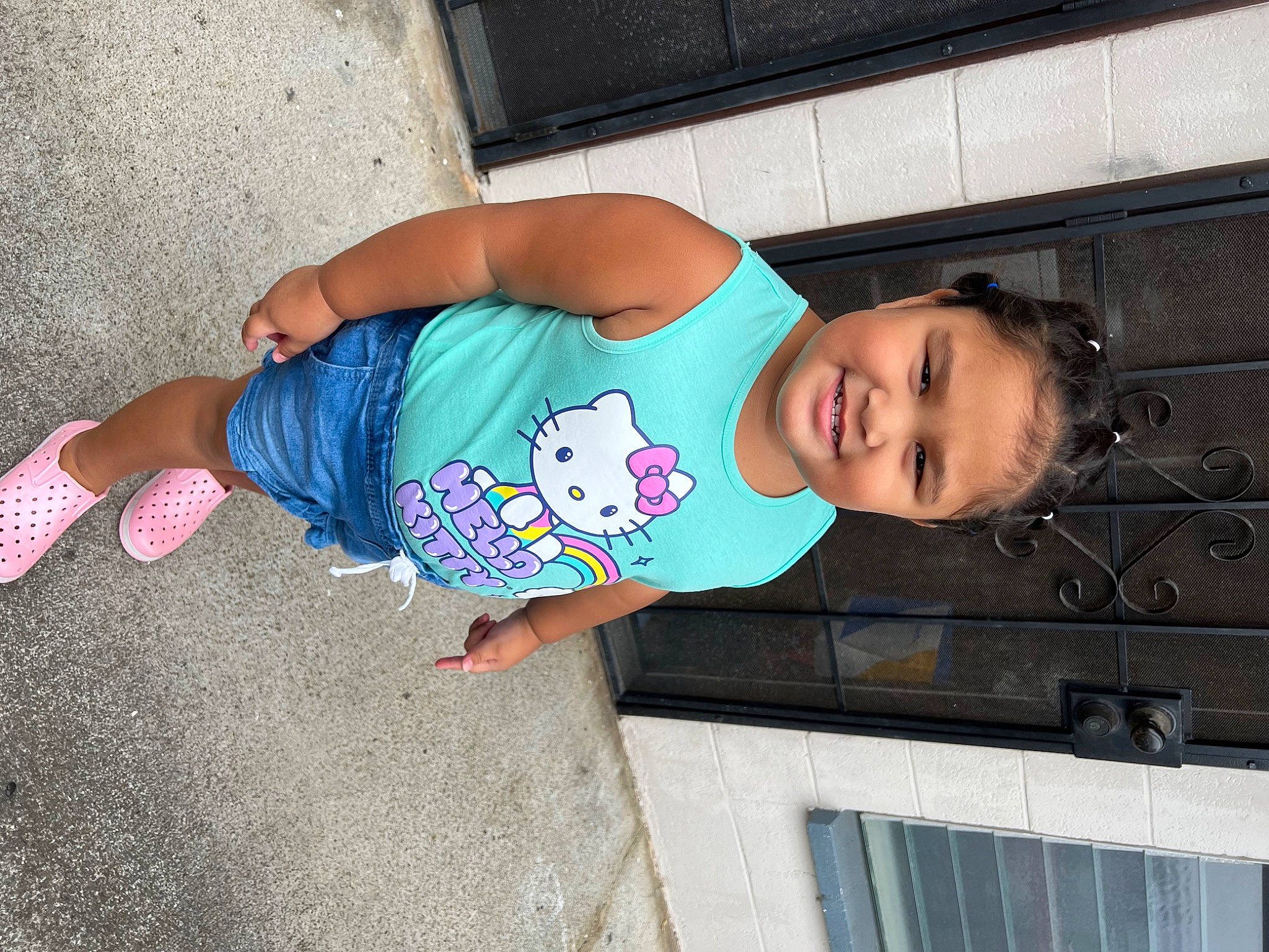 Amelia Grace is registered to the contest to win money with this photo: baby_toddler_clothing, child, facial_expression, flooring, foot, fun, hairstyle, happy, human_leg, joy, leisure, pattern, person, sitting, sleeve, smile, t_shirt, textile, toddler, vacation