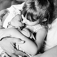 Maddy participe au concours pour gagner de l'argent avec cette photo : black_and_white, baby, child, toddler, girl, infant, family, love, hug, close_up, portrait, hands, affection, cute, headband, soft_focus, intimacy, indoor, people, sibling