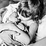 black_and_white, baby, child, toddler, girl, infant, family, love, hug, close_up, portrait, hands, affection, cute, headband, soft_focus, intimacy, indoor, people, sibling