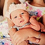 Maddy participe au concours pour gagner de l'argent avec cette photo : baby, child, hands, arm, floral_headband, dress, flower_pattern, skin, portrait, closeup, cute, infant, holding, person, family, together, love, tenderness, smile, happy