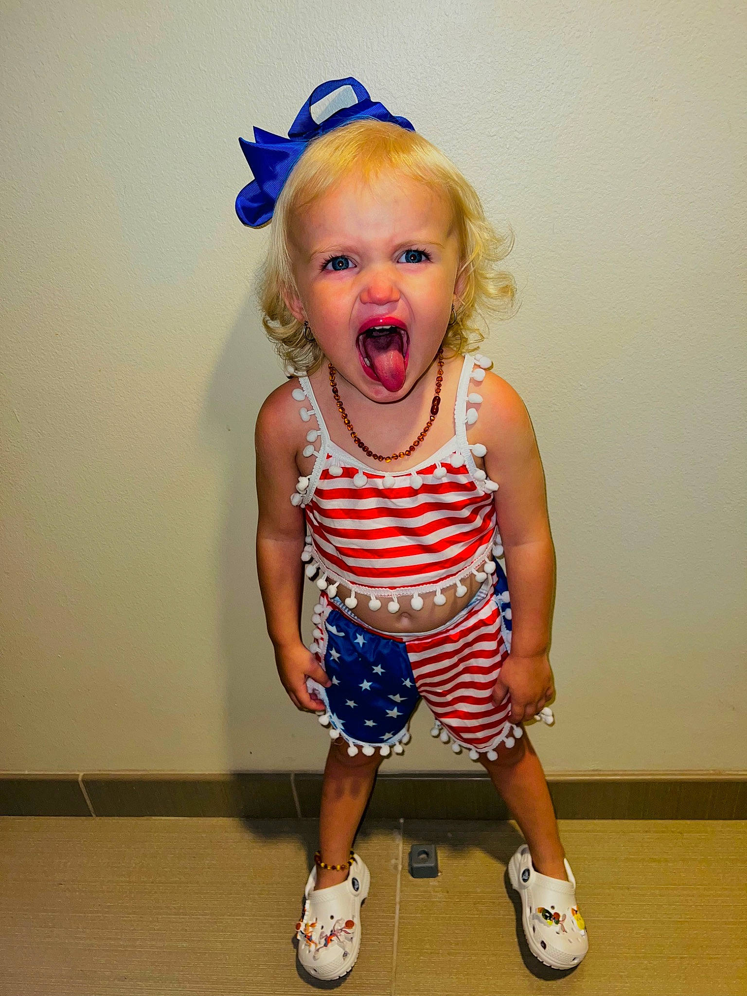 Kynslee is registered to the contest to win money with this photo: baby_toddler_clothing, child, day_dress, dress, elbow, electric_blue, eye, face, fun, hair, happy, headpiece, human_leg, knee, pattern, person, sleeve, smile, t_shirt, thigh