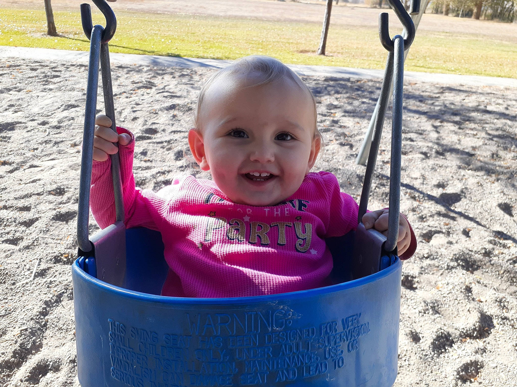 Aspen joined the competition — help win amazing prizes! child, fun, joy, outdoor_play_equipment, person, pink, play, playground, public_space, recreation, smile, swing, toddler, vacation