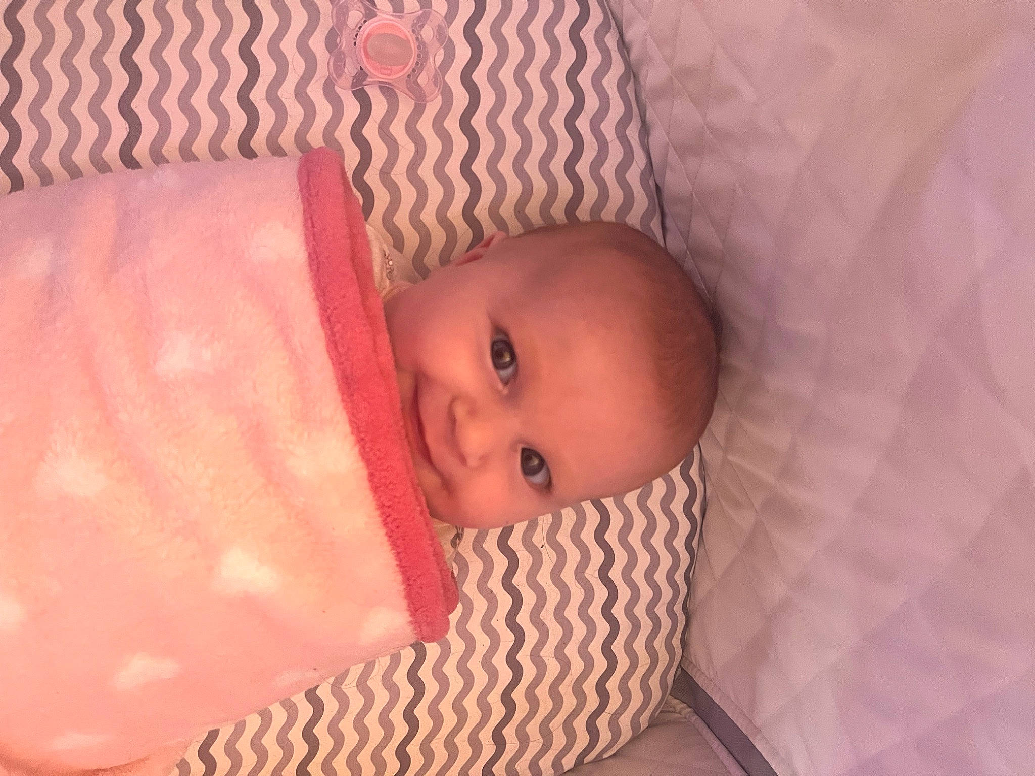 Esmé joined the competition — help win amazing prizes! baby, baby_products, baby_toddler_clothing, cheek, child, comfort, eye, eyebrow, face, head, headgear, infant_bed, iris, linens, lip, nose, person, pink, skin, toddler